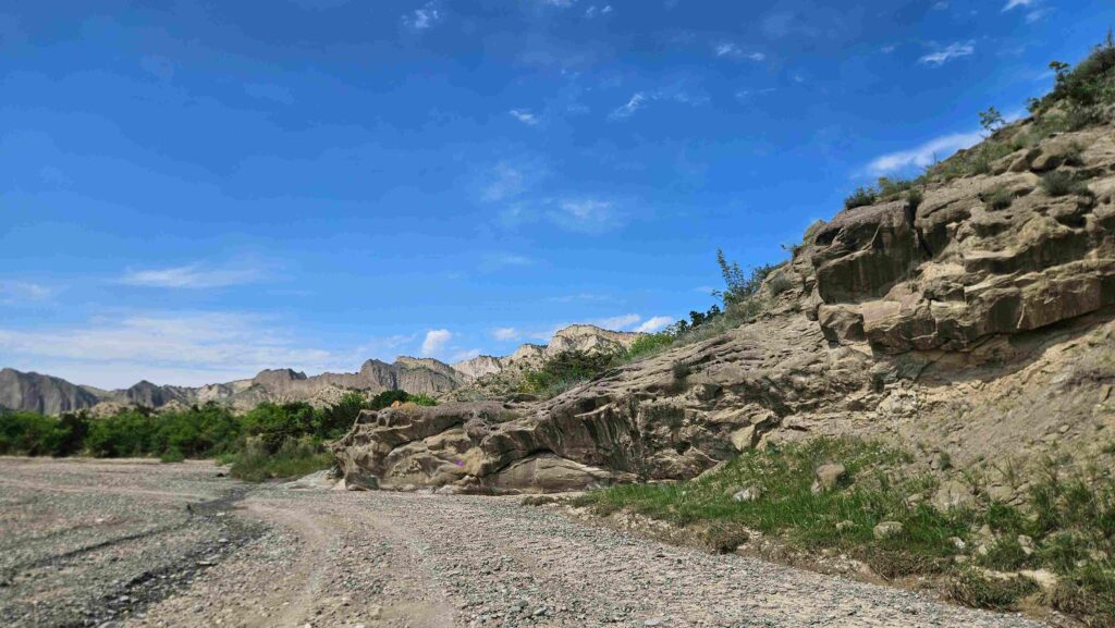 Eroded sandstone rock formation in a dry riverbed, Vashlovani canyon