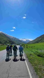 Juta Valley bike tour riders cycling toward Caucasus mountains Georgia