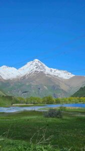 Kazbeki mountain flooded fields spring Juta Valley bike tour