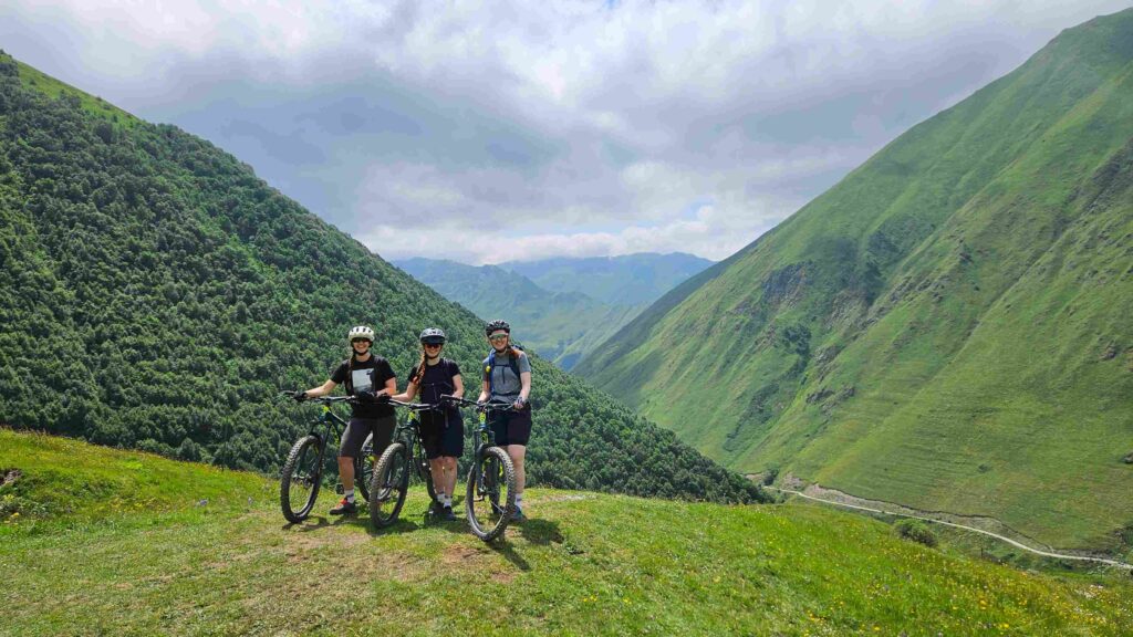 Climbing high above the lush green valleys on Day 1 of our Juta bike tour